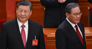 China's President Xi Jinping (L) and China's Premier Li Qiang 