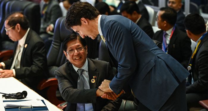 Canadian PM Justin Trudeau shakes hands with Philippines President Ferdinand Marcos Jr. 